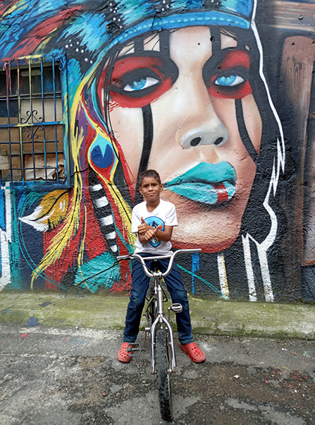 Boy in the Moravia barrio Medellin